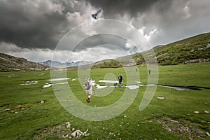 Hikers near Lac De Nino in Corsica photo