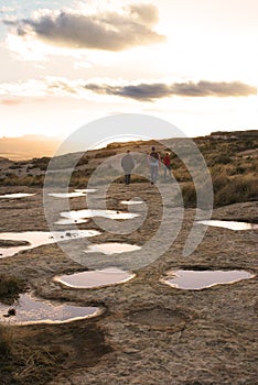 Hikers Near Rock Pools