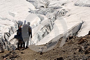 Hikers overlooking crevasse photo