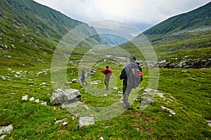 Hikers in raincoats on mountain