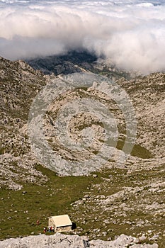 Hikers in a refuge in the mountains during a hike