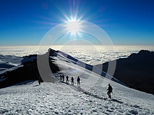 Hikers on the ridge ascend mount kilimanjaro the tallest peak in africa
