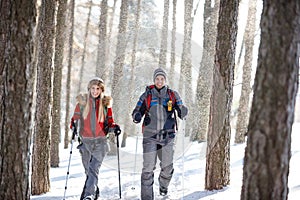 Hikers on snowy winter hiking on mountain