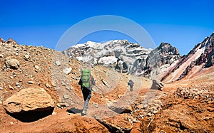 Hikers on their way to Aconcagua as seen in the background, Argentina, South America photo