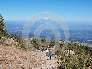 Hikers on the Timberline Trail on Mount Hood, Oregon.