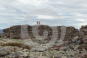 Hikers on top of a rock formation