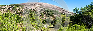 Hikers at Enchanted Rock State Natural Area in Texas photo