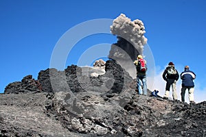 Hikers on volcano etna photo