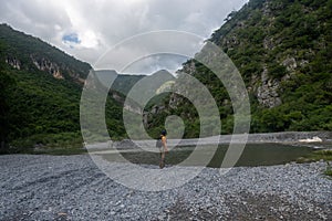 hikers walking on Rio Pilon in Monterrey, mountain water