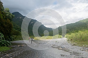 hikers walking on Rio Pilon in Monterrey, mountain water