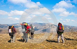 Hikers watch the terrain