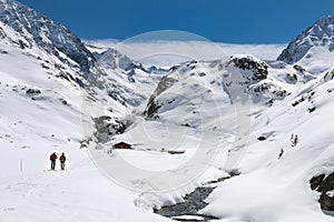 Hikers In Winter Valley, Austria