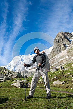 Hikier is climbing mountain in Caucasus