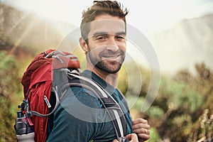 Hiking, adventure and portrait of man on mountain for fitness, relax and travel journey. Backpack, summer and workout