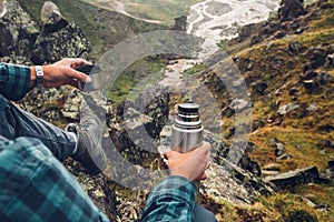 Hiking Adventure Tourism Vacation Holiday Concept. Unrecognizable Traveler Man Holding Thermos In His Hand And Enjoy View Of