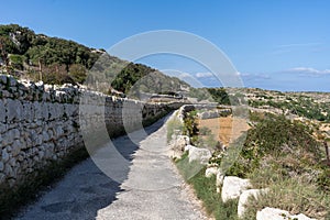 Hiking along beautiful Maltese coastline of Mistra Bay