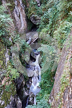 Hiking along the canyon Gorges Mysterieuses de Tete Noire in Trient, region of Martigny in Valais, Swiss Alps, Switzerland