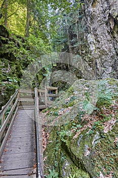 Hiking along the canyon Gorges Mysterieuses de Tete Noire in Trient, region of Martigny in Valais, Swiss Alps, Switzerland