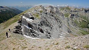 Hiking along a mountain ridge overlooking the two valleys of Saint Veran and Ceillac Cristillan