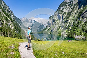 Hiking in the alps near Berchtesgaden at the Obersee, Koenigssee