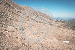 Hiking in the Alps on panoramic footpath, toned image