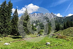 Hiking in the Alps on a sunny day. Wilder Kaiser chain near Wochenbrunner Alm,Tyrol, Austria