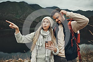 Hiking, anxiety and lost couple with a phone in nature for direction, map or navigation with stress. Backpacking, travel