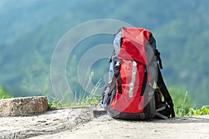 Hiking backpack travel gear on mountain. Items include hiking photo