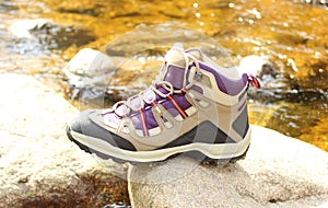 Hiking boot over a mountain stream