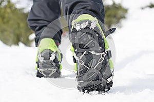 Hiking boots with crampon, equipment for ice climbing photo
