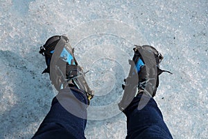 Hiking boots with crampon on Ice photo