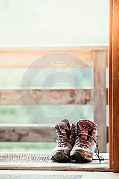 Hiking boots inside of a rustic mountain chalet, Austria