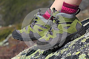 Hiking boots pair and mountain background