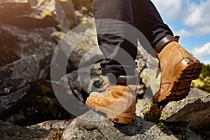 Hiking boots on the rock in the mountains.