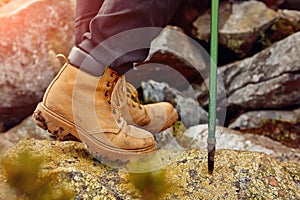 Hiking boots on the rock in the mountains.