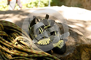 Hiking boots and rope on campfire background. Lifestyle travel relationship