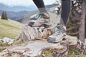 Hiking boots on stump