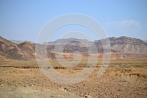 Hiking at bottom of Makhtesh Ramon Crater, Mitzpe Ramon, Negev desert, Israel