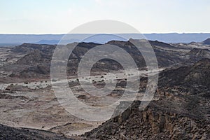 Hiking at bottom of Makhtesh Ramon Crater, Mitzpe Ramon, Negev desert, Israel