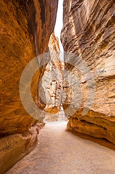 Hiking through the canyon in the ancient city of Petra (Jordan)