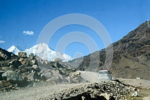 A Hiking Car driving on Curvy Mountain winding Road, leading traveler vehicle towards Everest Base Camp. Spectacular mountainous