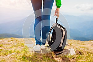 Hiking in Carpathian mountains. Hiker woman carrying backpack enjoying landscape. Traveling in summer Ukraine