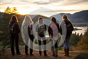 Hiking Companions Conquering Peaks, Friends Reaching New Heights at Majestic Mountain Sunset