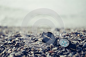 Hiking compass on coast