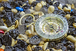 Hiking compass on trail mix