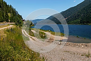 Hiking and cycling trail near alpine artificial reservoir lake Zoccolo Ultental South Tyrol Italy