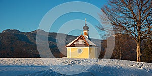 Hiking destination in the bavarian alps, little yellow chapel Maria Rast