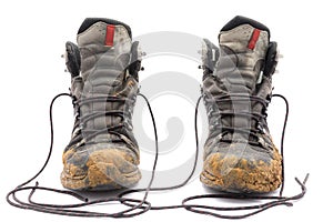 Hiking dirty boots on white background