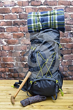Hiking equipment, rucksack, boots and backpack.