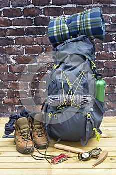 Hiking equipment, rucksack, boots and backpack.